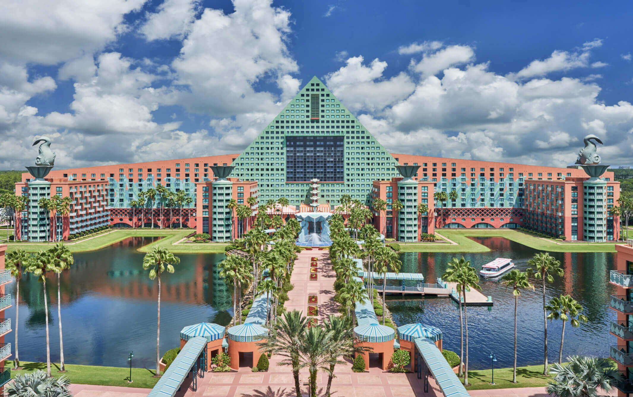 The exuberant Walt Disney World Dolphin Hotel has a bright modern architecture and is surrounded by a lake 